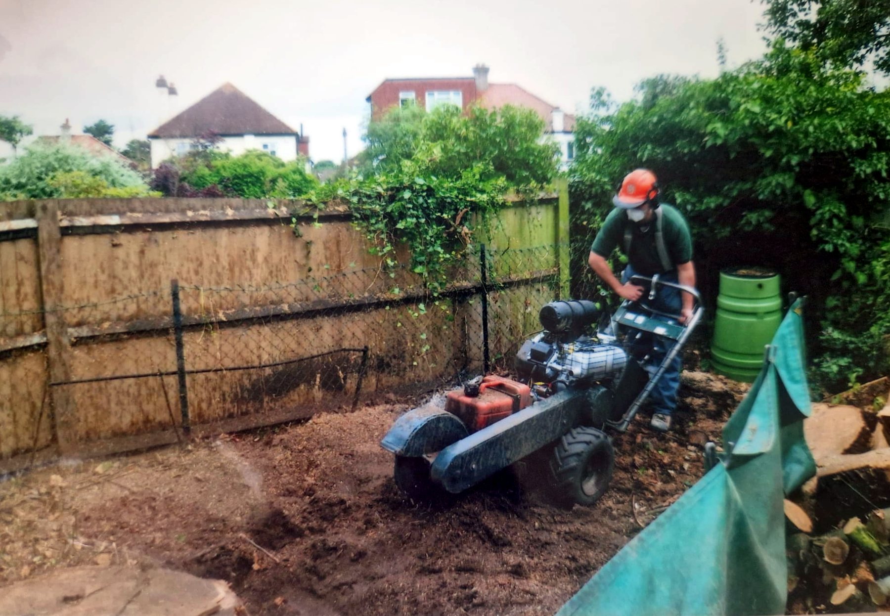 Nearly finished: the stump ground away and the ground left level by the fence